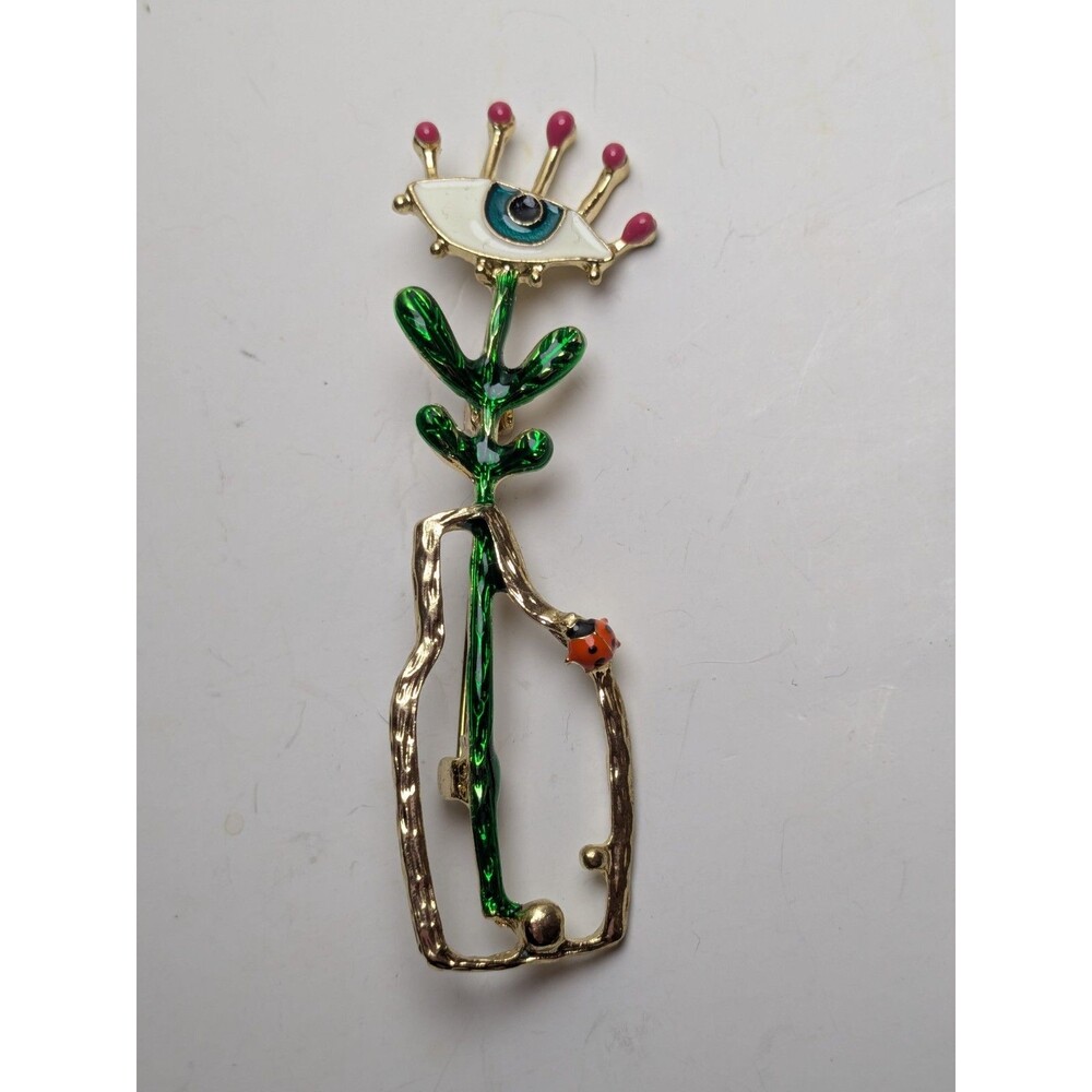 Goldtone Plant With Eye In Vase With Ladybug Brooch